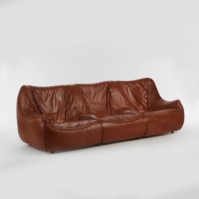 leather couch in an empty room