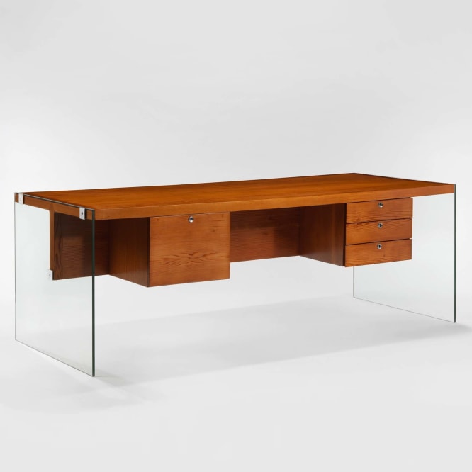 photograph of wooden desk by Motte in a blank room