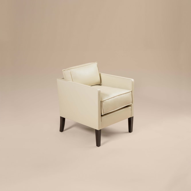 photo of an armchair in an empty room