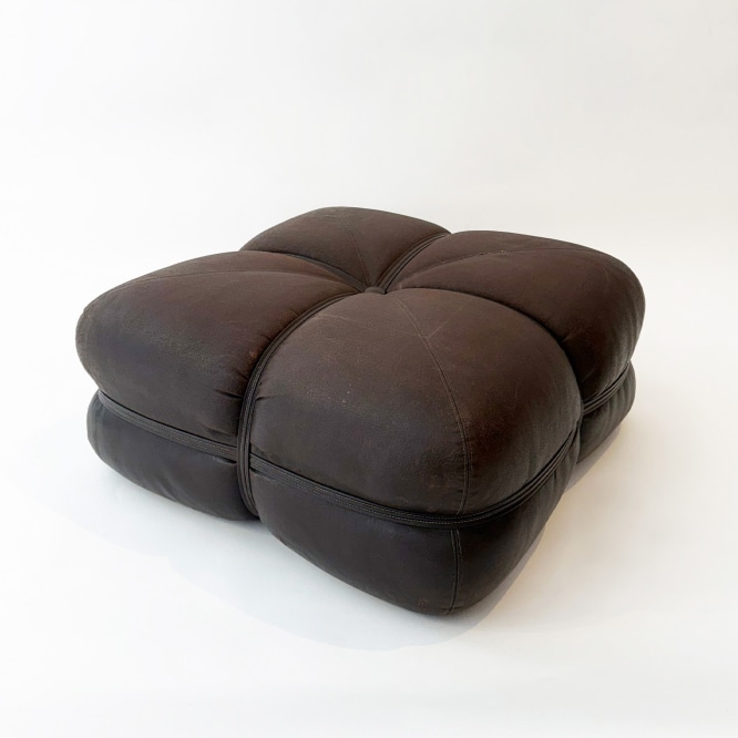 brown pouf in a white room