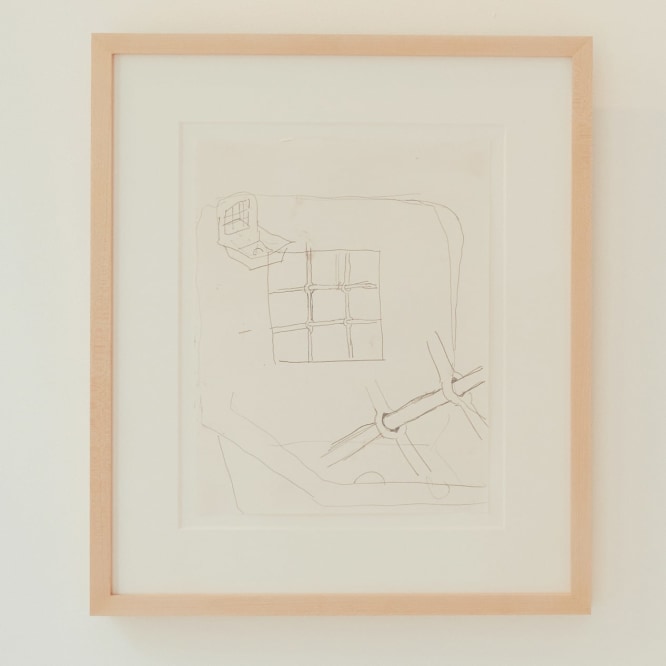 drawing of a drain framed on a white wall