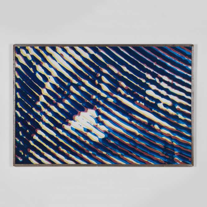 photograph of a pixelated artwork in a white room