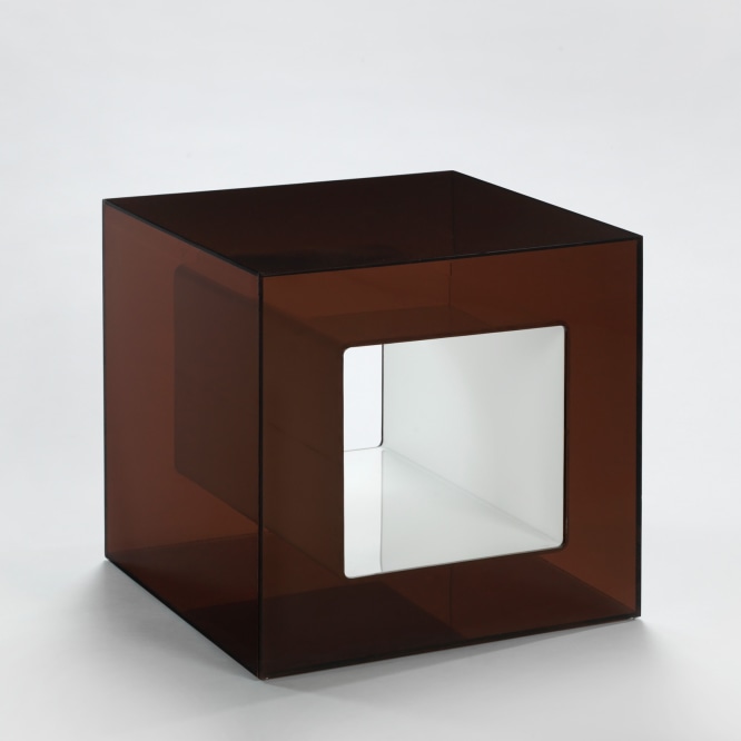 photograph of plexiglass cube in a blank room 