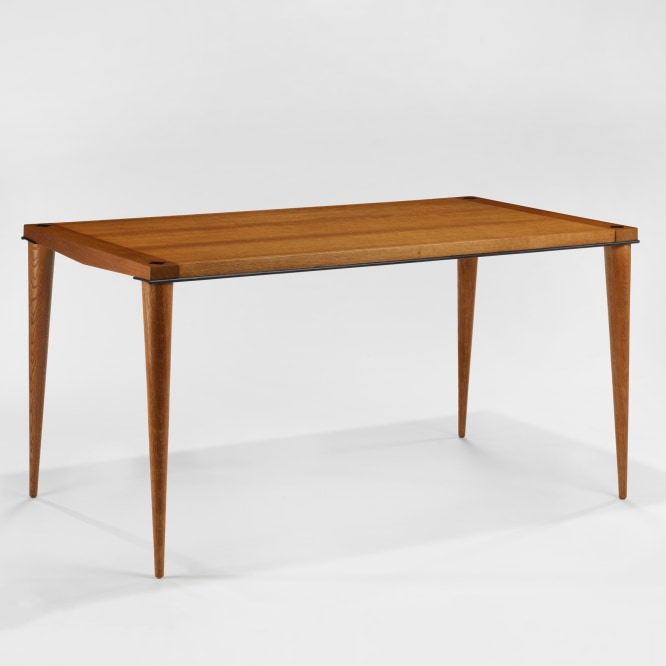 photograph of wood dining table in a blank room