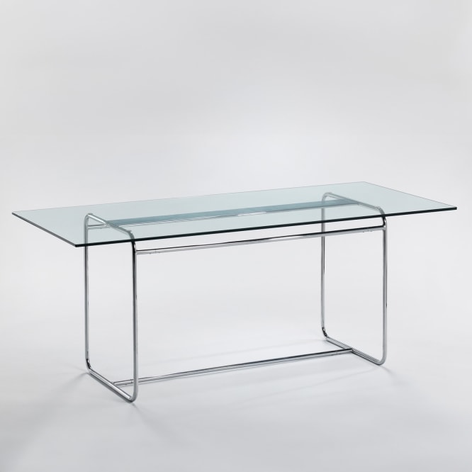Arnal glass and metal dining table in an empty room