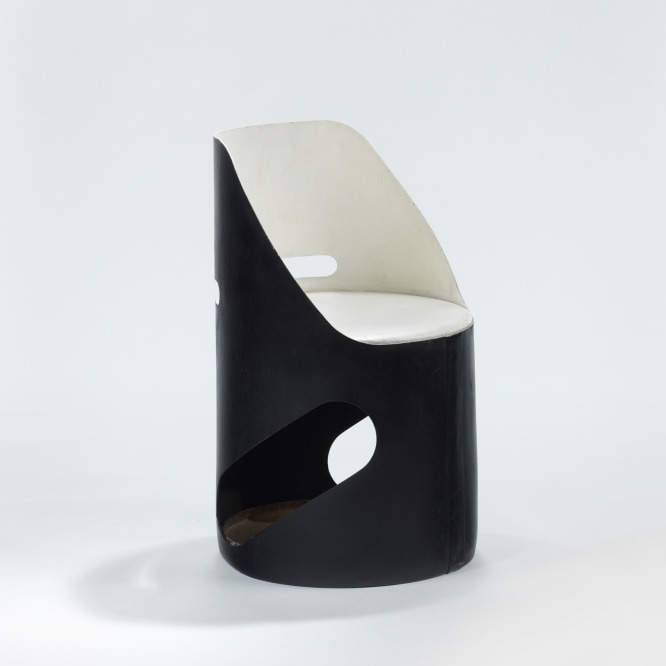 black and white chair in a blank room