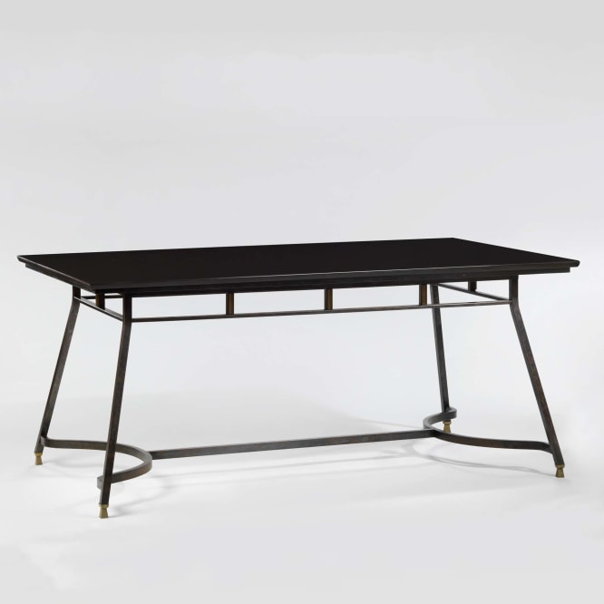 photograph of a black table in a blank room