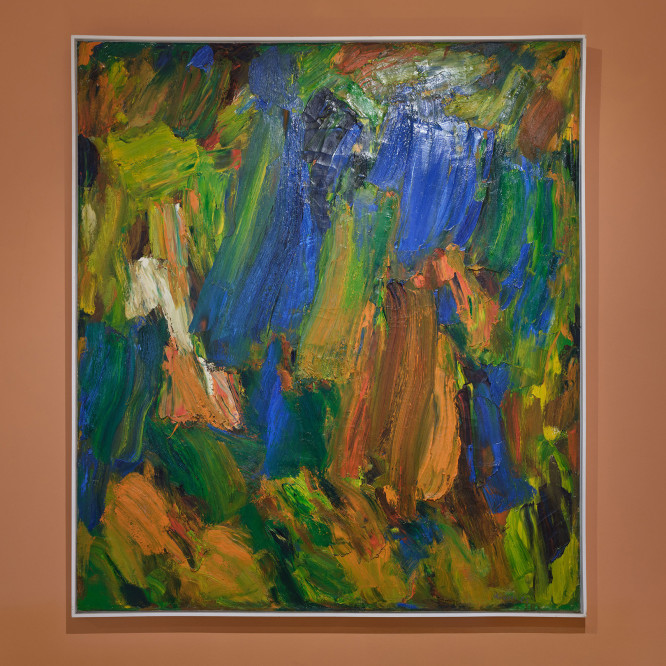 painting on an orange wall on view in an exhibition 