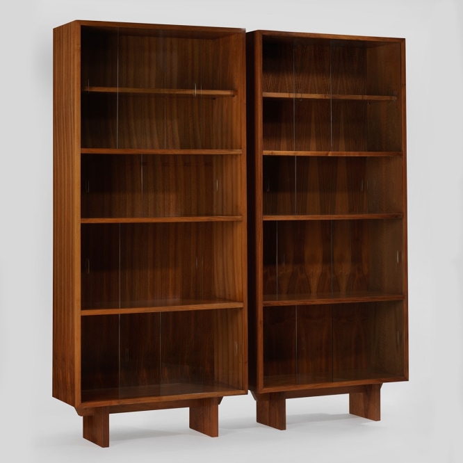 pair of bookcases in an empty room