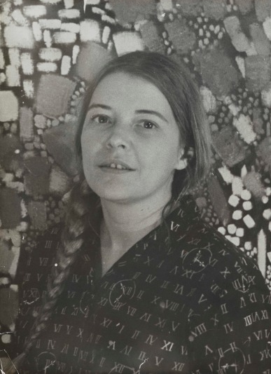Black and white portrait of a woman with her hair in a braid against an abstracted geometric background