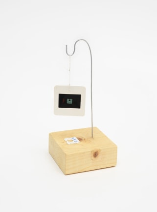 Untitled, 2017 35mm slide in a cardboard mount, white plastic bread tie, ink, wire, thread and wool