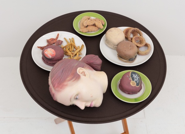 Josh Kline, 15% Service (Applebee's Waitress' Head), 2018. 3D-printed sculptures in plaster with inkjet ink and cyanoacrylate, custom tray, wooden stand, 38 1/4 x 28 1/2 x 28 1/2 inches (97.2 x 72.4 x 72.4 cm).