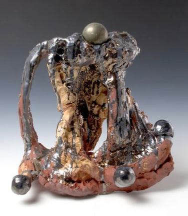 Pyrite Fourchette, 2007. Ceramic, bronze sphere, formica pedestal. Sculpture - 16 x 17.5 x 5 inches (40.6 x 44.5 x 12.7 cm); pedestal: 40 x 25 x 17 inches (101.6 x 63.5 x 43.2 cm). MP 38