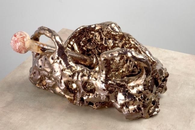 Death Cult Gold, 2007. Ceramic, formica pedestal. Sculpture - 7.5 x 13 x 9 inches (19.1 x 33 x 22.9 cm); pedestal: 31 x 19 x 19 inches (78.7 x 48.3 x 48.3 cm). MP 33