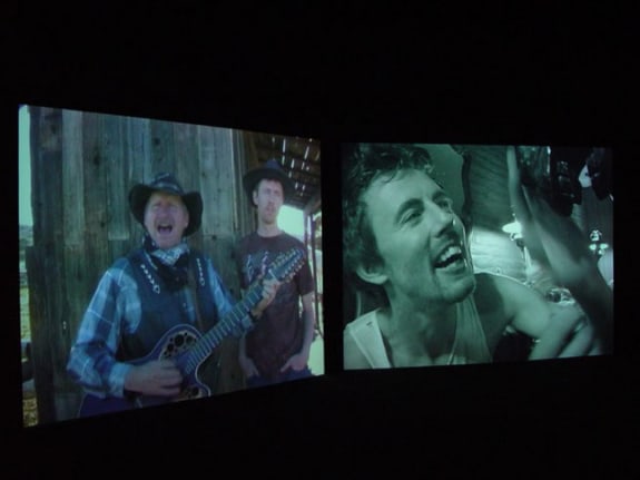 Installation view from "Home," 2003. Dual screen DVD shot with digital camera, 32 minutes. Edition of 5. MP V-7