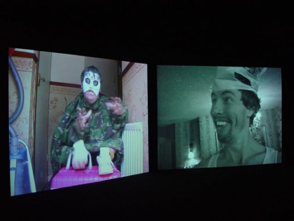 Installation view from "Home," 2003. Dual screen DVD shot with digital camera, 32 minutes. Edition of 5. MP V-7