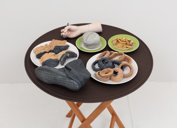 Josh Kline, 10% Tip (Applebee's Waitress' Hand and Foot), 2018. 3D-printed sculptures in plaster with inkjet ink and cyanoacrylate, custom tray, wooden stand, 36 x 28 1/2 x 28 1/2 inches (91.4 x 72.4 x 72.4 cm).
