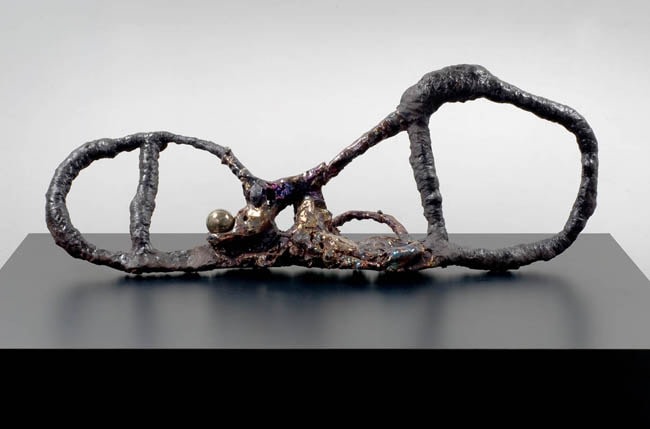 Figure Maker with Sphere, 2007. Ceramic, formica pedestal, sculpture: 18 x 46 inches (45.7 x 116.8 cm); pedestal: 24 x 40 x 64 inches (61 x 101.6 x 162.6 cm). MP 29