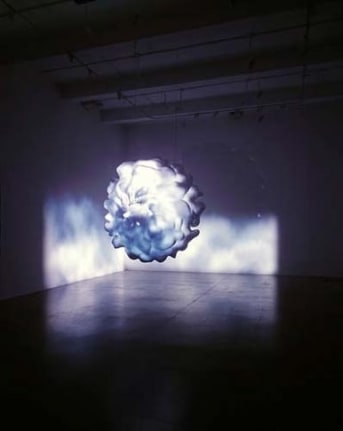 Dust, 2006. Fiberglass sculpture, Harmon Kardon HS100 5.1 sound system, Sony XGA VPL-PX41 projector, 2 Sanyo PLC-XU48 projectors, 2 dvd players, 2 dvds, 1 master tape. 72 x 72 x 72 inches (182.9 x 182.9 x 182.9 cm). MP 463