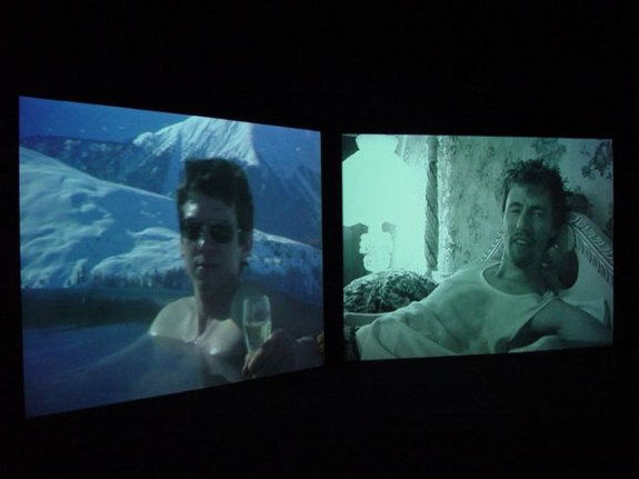 Installation view from "Home," 2003. Dual screen DVD shot with digital camera, 32 minutes. Edition of 5. MP V-7