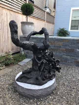 Yulla Lipchitz sculpture of Seated Woman Twined with Tree Trunk.