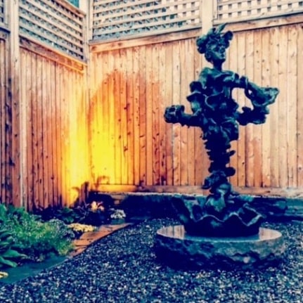 Yulla Lipchitz sculpture in rock garden.