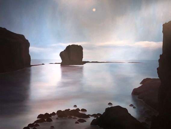Image of April Gornik's landscape painting "Moon Bay" showing a very calm body of water, surrounded by rock formations with a pale sky in the background.