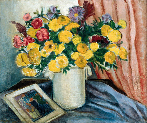 Image of a sold still life painting featuring a white pitcher full of yellow, red and purple flowers on a blue piece of fabric next to a framed photographby Richard Lever.