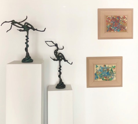 Two Yulla Lipchitz sculptures next to two Carl Holty paintings.