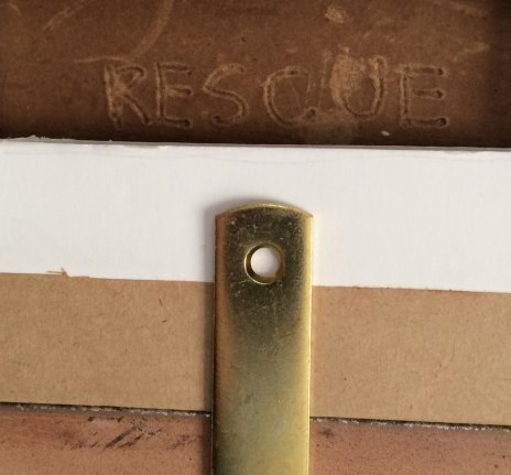 Image of title on verso of "Rescue" oil painting by Maurice Golubov.