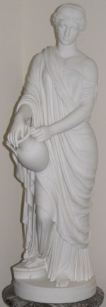 Image of white marble statue entitled &quot;Woman of Samaria&quot; by William Rinehart depicting a woman wearing a draped carrying a water jug.