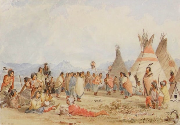 Image of Seth Eastman's sold watercolor &quot;Scalp Dance&quot; showing a group of Native Americans sitting and standing near some teepees with mountains in the distance.