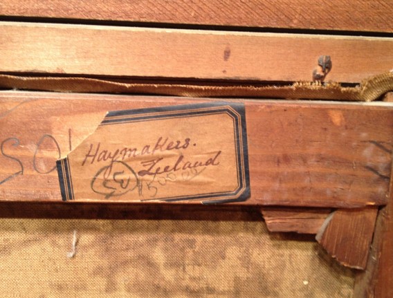 Image of label verso on &quot;Haymakers Zeeland&quot; painting by George Hitchcock with title and original price.