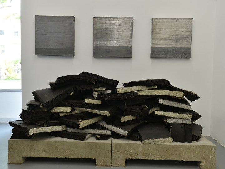 TRAVIS J. WAGNER Ta Biblia installation view 2014, tar paper, twine, adhesive, concrete and steel, 33 x 88 x 40 inches.