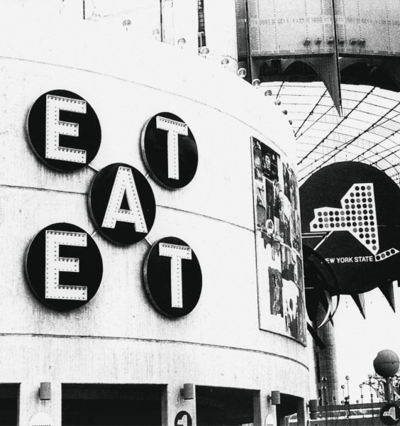 Black and white installation view of Robert Indiana's EAT sculpture at the New York World’s Fair