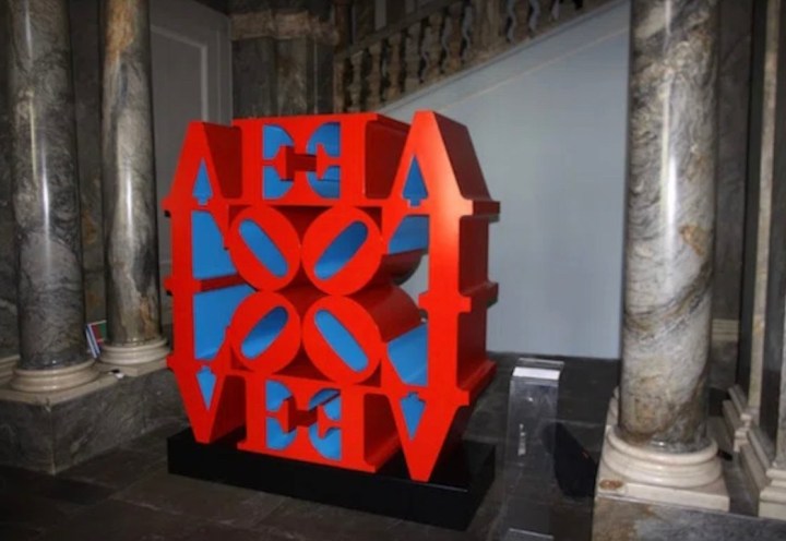 Installation view of the exhibition Robert Indiana: To Russia with Love at the State Russian Museum with Indiana's polychrome red and blue LOVE Wall sculpture