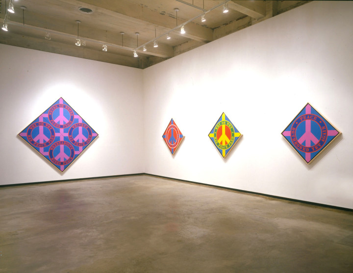 Installation view of Robert Indiana: Peace Paintings at Paul Kasmin Gallery New York, featuring four of Indiana's diamond shaped Peace paintings.