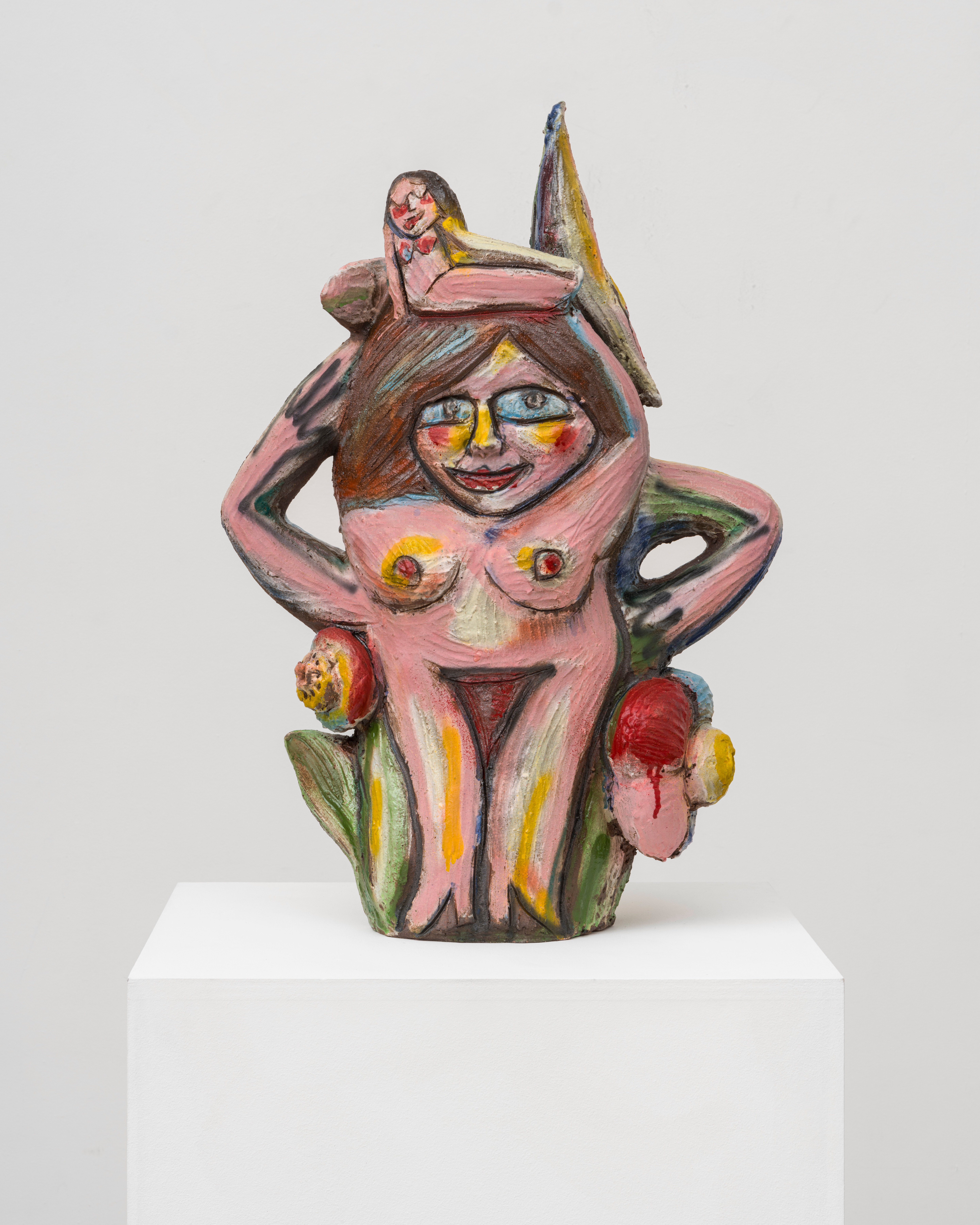 A ceramic sculpture by Ruby Neri of three female forms surrounded by flowers. 