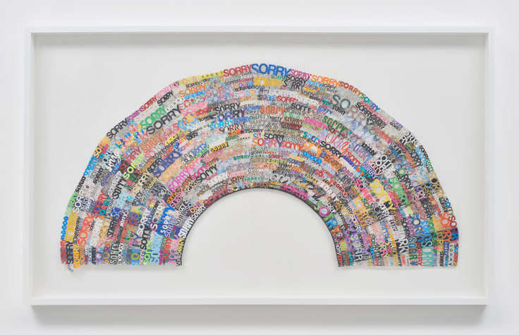 Collaged, multimedia depiction of a rainbow composed of the word sorry by SIMON EVANS&trade;.