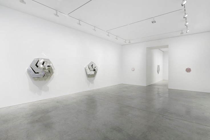 view of several geometric, glass artworks