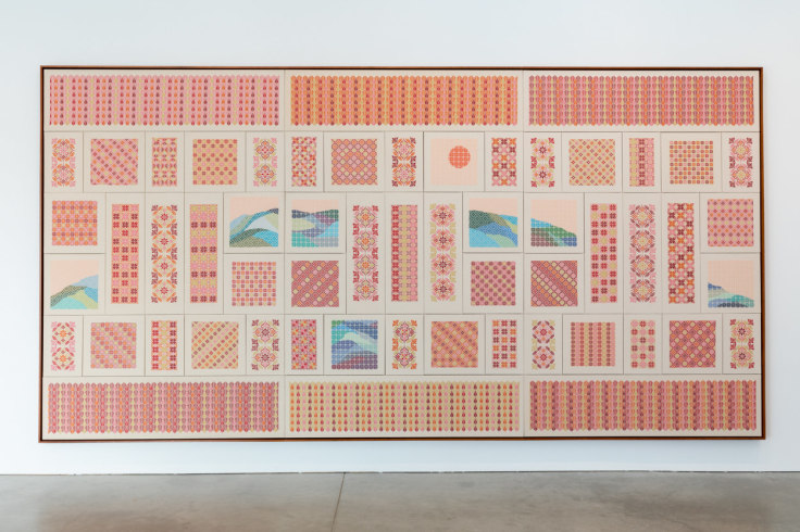 installation view of a large red embroidered artwork by Jordan Nassar