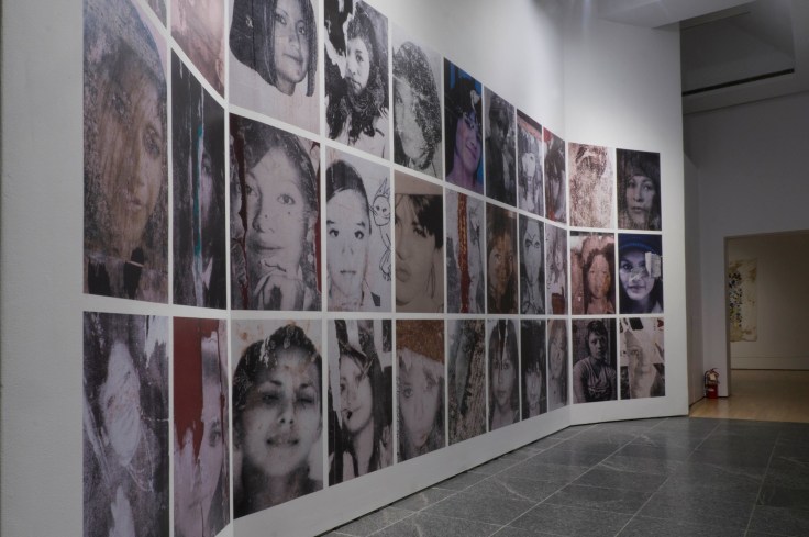 Installation view of 30 photos of missing women