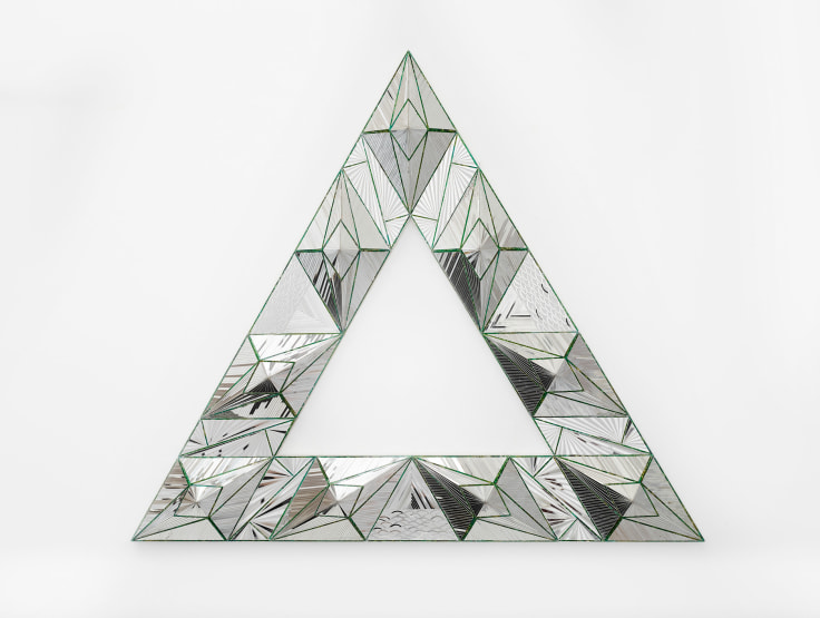 Geometric reverse mirror panel with painted details mounted to a wall by Monir Shahroudy Farmanfarmaian.