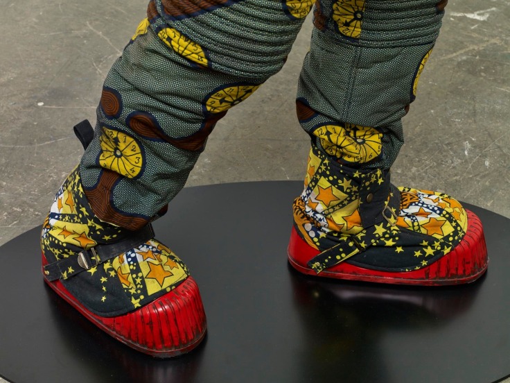 close up of the astronaut's star-studded shoes