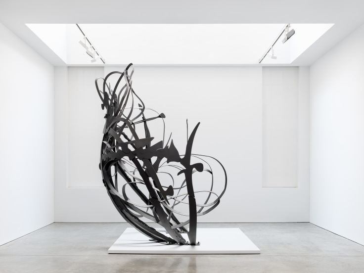 Large scale steel sculpture with arms of implied motion
