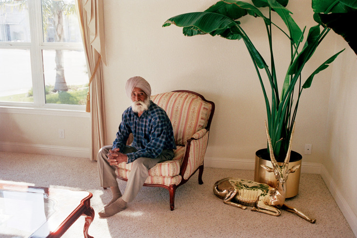 Archival pigment print of Kundan Singh in his son's home.