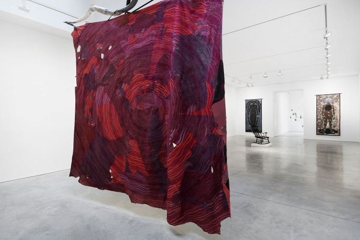 large red fabric hanging from the ceiling