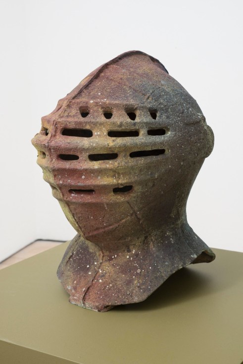 knight's helmet covered in varying hues