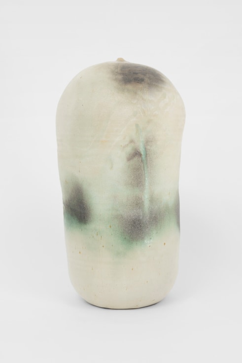 vertical ceramic closed white form with hints of green and grey