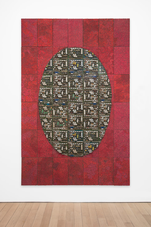 oval composed of electrical components in the middle of a red rectangle composed of more electrical components